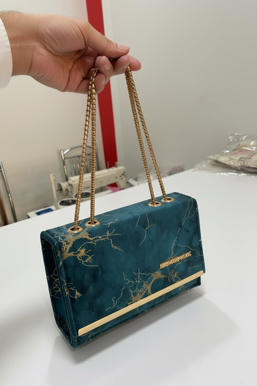 Elegant marble-effect clutch with luxe gold chain strap